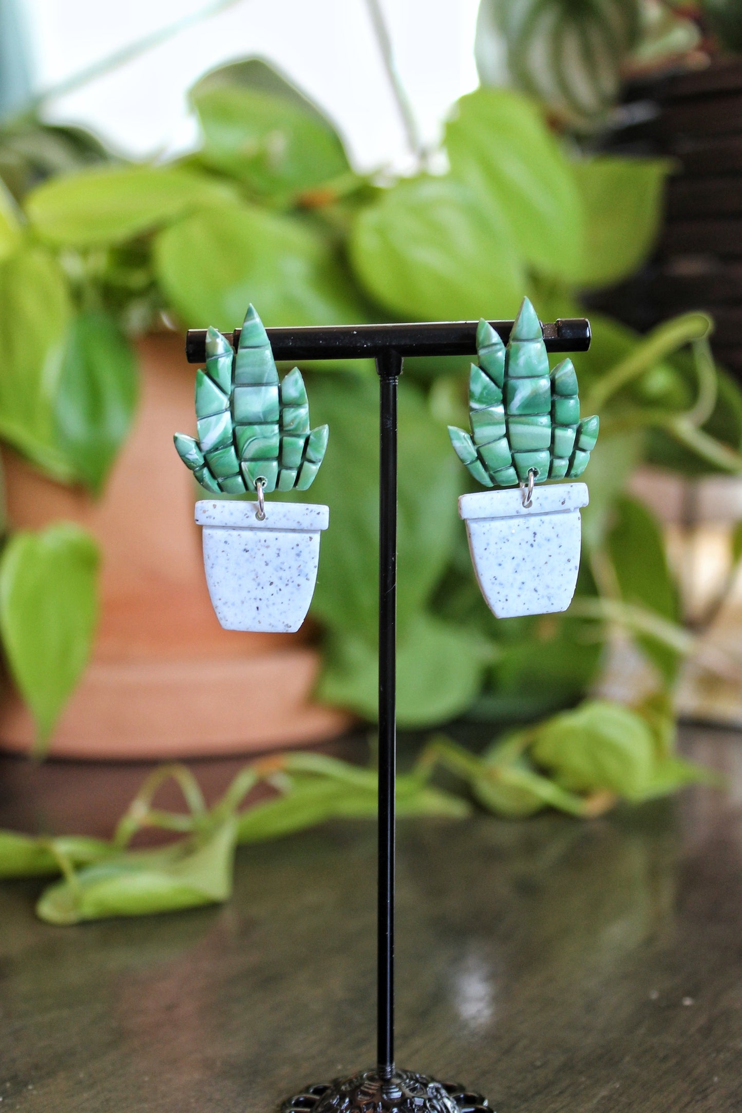 Handmade silver and gold potted snake plant earrings with lightweight stainless steel posts and ear wires