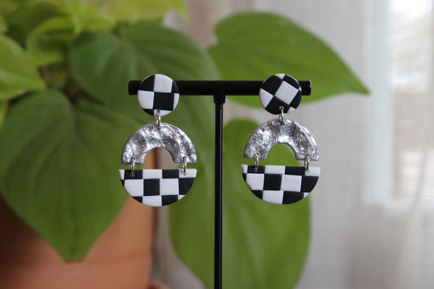 Silver metallic checkered dangle earrings on stainless steel studs with 1.75 inch drop