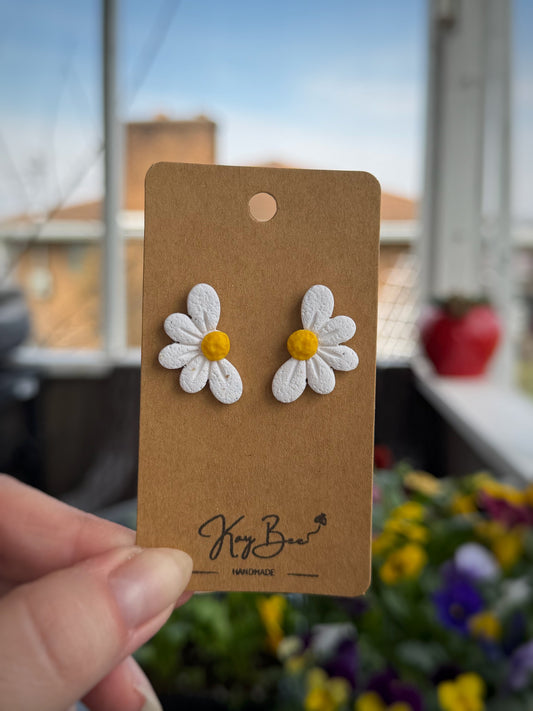 Half daisy stud earrings with one inch drop spring design