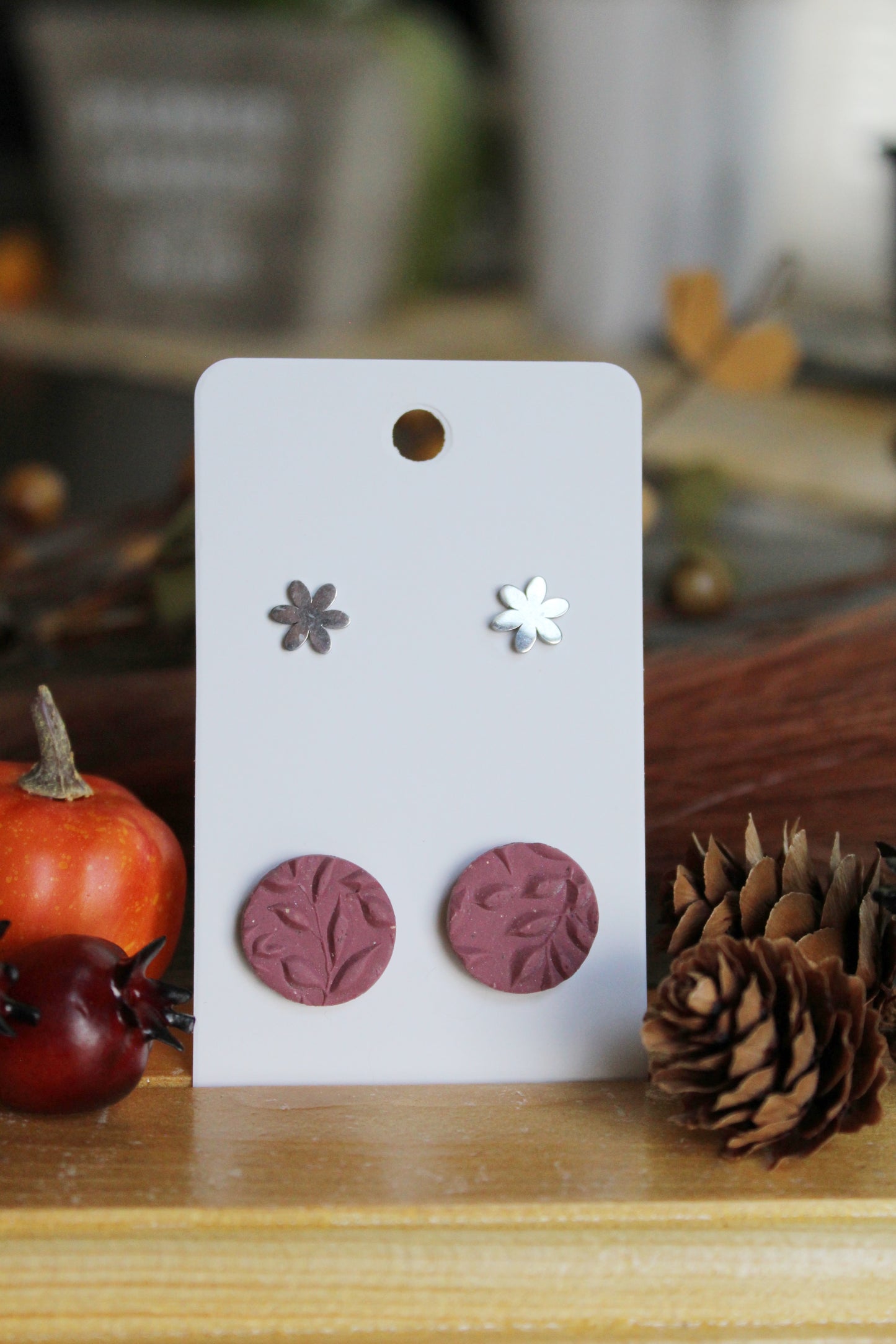 Mauve leaf textured round stud earrings and silver daisy stud earrings