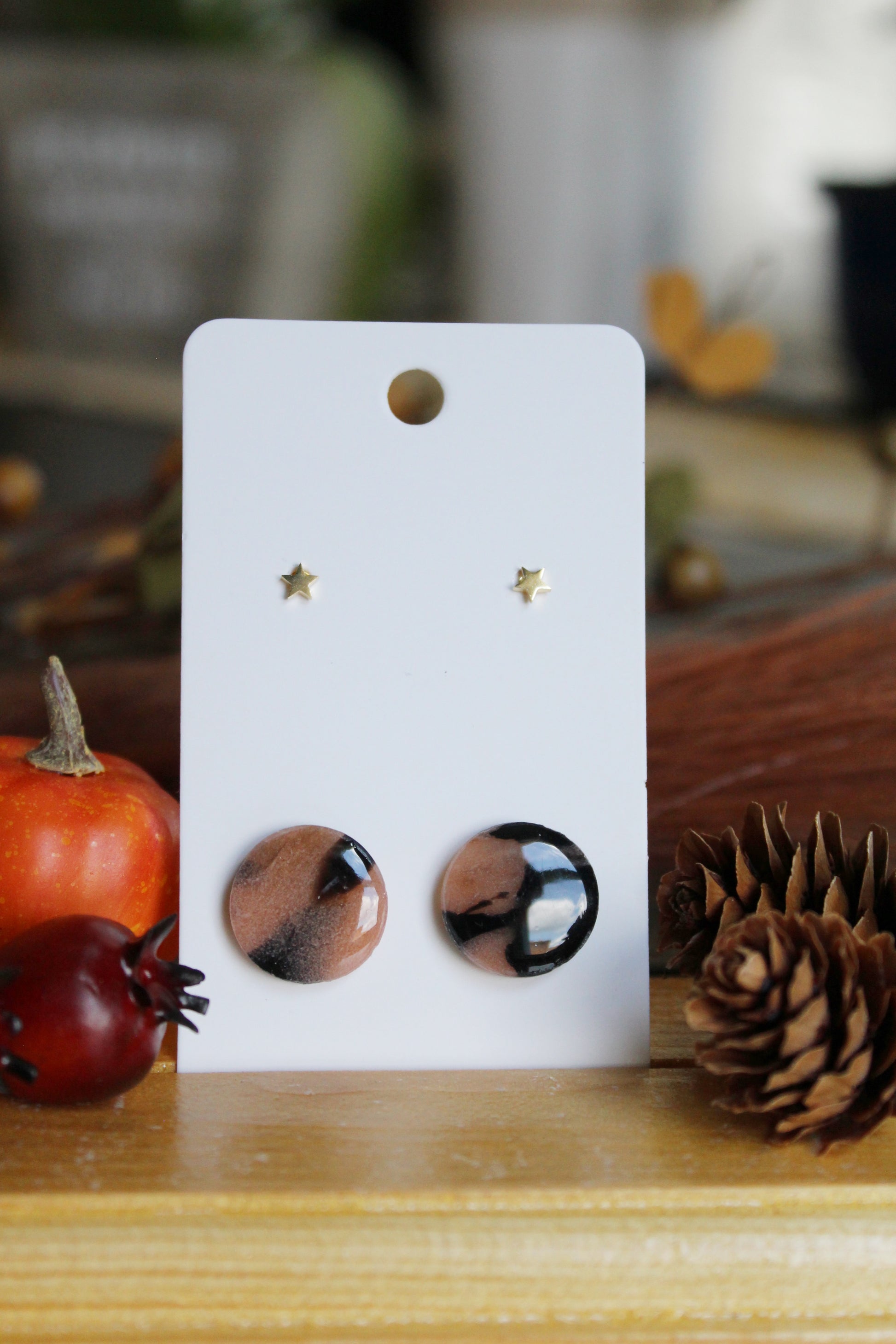 Round tortoiseshell stud earrings and tiny gold star stud earrings